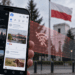 Smartphone displaying social-media feeds with a Polish flag and government building behind, illustrating possible platform restrictions