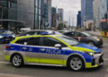 Marked Polish police patrol car on a street in Warsaw. File photograph unrelated to the Tusk threat investigation.