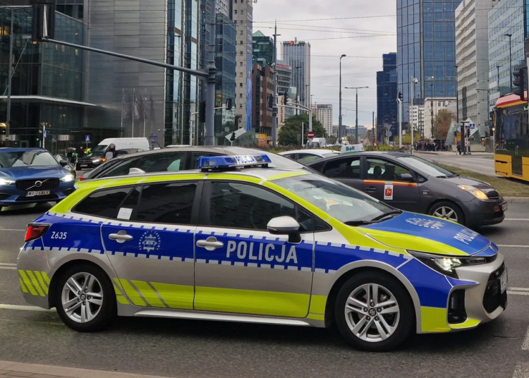 Marked Polish police patrol car on a street in Warsaw. File photograph unrelated to the Tusk threat investigation.