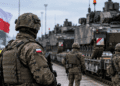 Polish soldiers and military vehicles in a controlled readiness setting