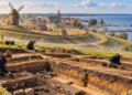 Digitally created reconstruction of Windmill Hill in Puck above a modern archaeological excavation