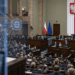 Digitally created view of Poland’s Sejm chamber with a restrained digital-network overlay