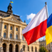 Digitally created illustration of Polish and Ukrainian flags against a historic-style civic building, representing a diplomatic dispute; not a documentary photograph.