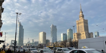 Warsaw skyline showing the Palace of Culture and Science and Varso Tower, photographed in December 2025 by Vikebe (CC0), cropped to 16:9