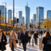 Morning commuters at Rondo Daszyńskiego in Warsaw with trams and the city business skyline